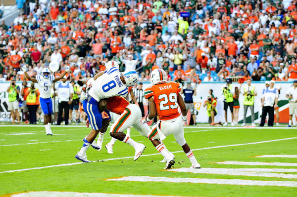 Hurricanes DB, Jamal Carter, hits Duke WR, Aaron Young, as he scores a touchdown