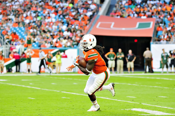 Malcolm Lewis returns a kickoff