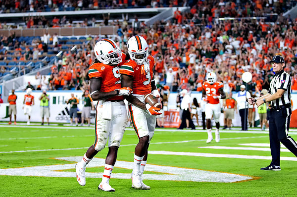 Malcolm Lewis congratulates Stacy Coley on his touchdown
