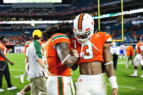 Malcolm Lewis and Stacy Coley congratulate each other after the game