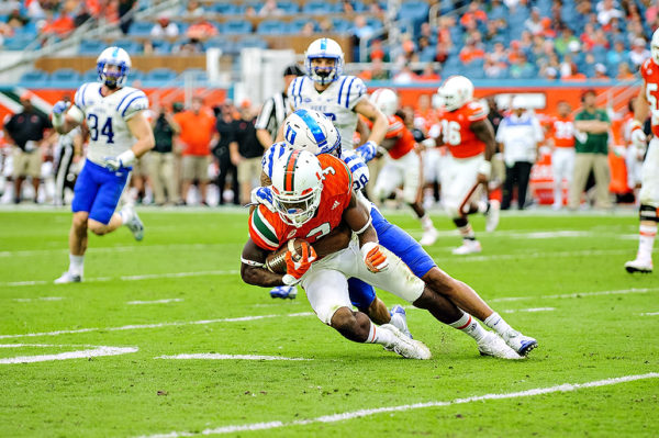 Stacy Coley tries to spin out of a tackle