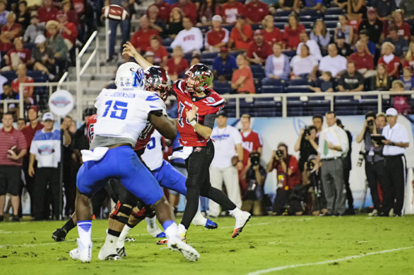 Mike White, Western Kentucky QB, throws a pass from the pocket