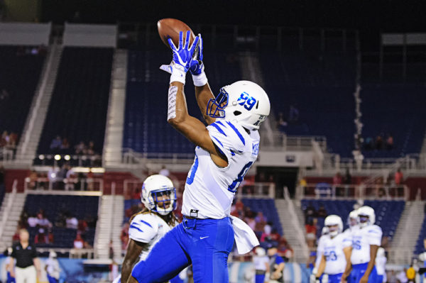 Phil Mayhue, Memphis WR, leaps for a pass in warmups