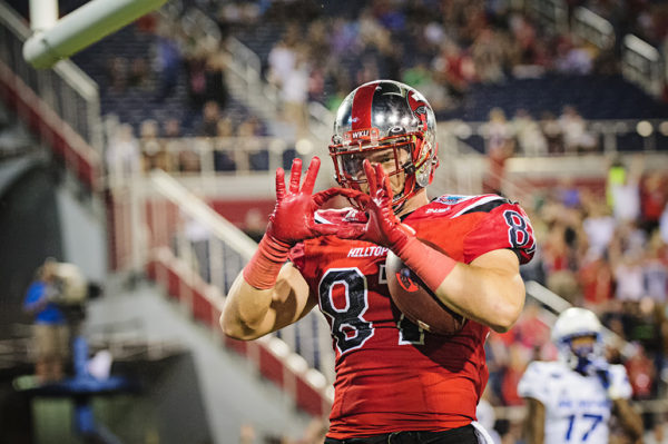 WKU TE, Stevie Donatell, throws up a sign to celebrate a touchdown