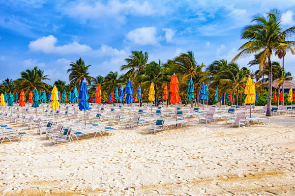 Beach chairs and umbrellas line the beaches of Castaway Cay