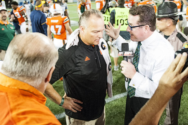 Mark Richt gives an interview to ESPN after the Hurricanes win
