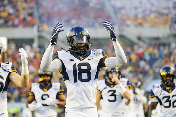 Marvin Gross Jr, West Virginia S, pumps up the fans in the endzone