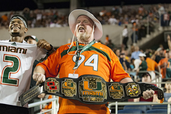 A Miami Hurricanes fan shows off his custom made championship belt