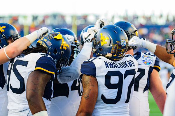 West Virginia Defensive line huddles up before the game
