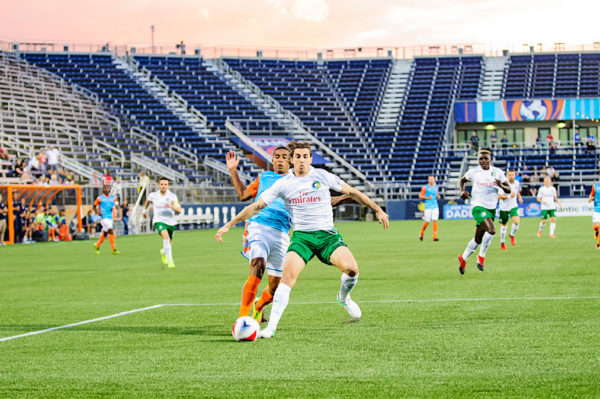 A battle for the ball between Miami FC and the New York Cosmos