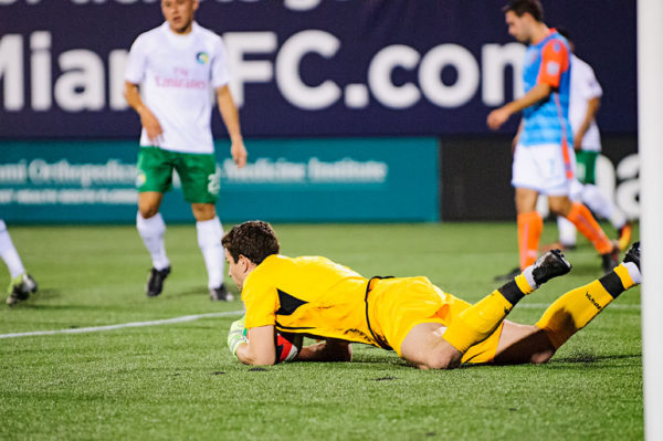 Goalie, Jimmy Maurer, collapses on the shot by Miami FC