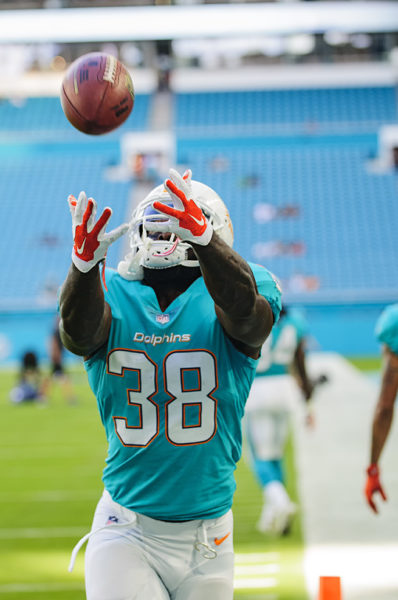 Dolphins RB #38, De'Veon Smith, looks to haul in a catch during warm ups