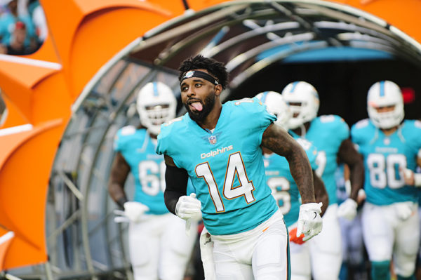 Dolphins WR #14, Jarvis Landry, runs out through the tunnel