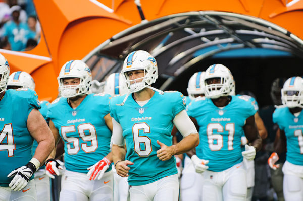 Dolphins QB #6, Jay Cutler runs through the tunnel