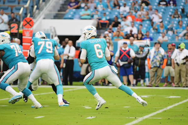 Jay Cutler, Dolphins QB #6, looks to throw down field