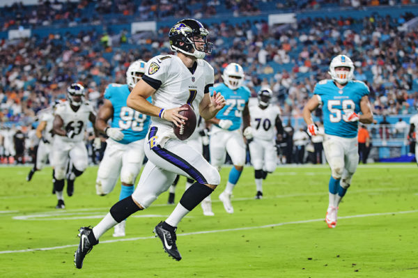 Ravens QB #1, Josh Woodrum, rushes in for a touchdown