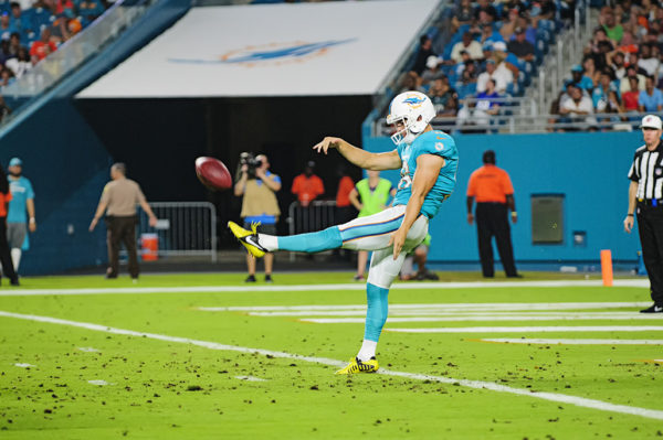 Matt Haack, Dolphins #16, punts the ball