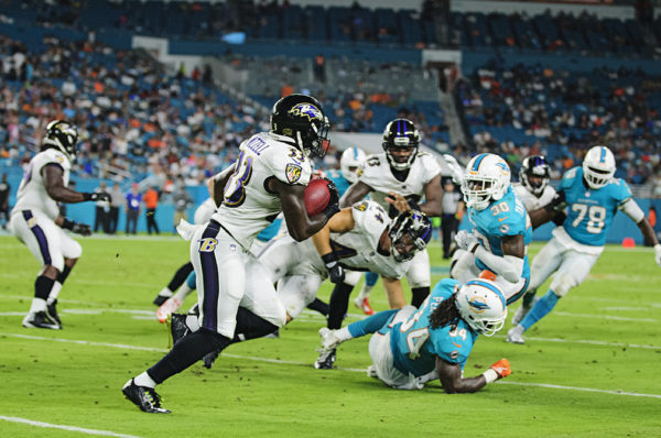 Ravens RB #33, Taquan Mizzell, returns a kickoff