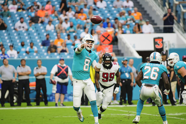 Dolphins QB, #8 Matt Moore, throws a pass during a game against the Atlanta Falcons