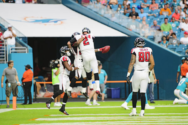 Matt Ryan and Devonta Freeman celebrate Freeman's touchdown run in the 1st quarter against the Dolphins