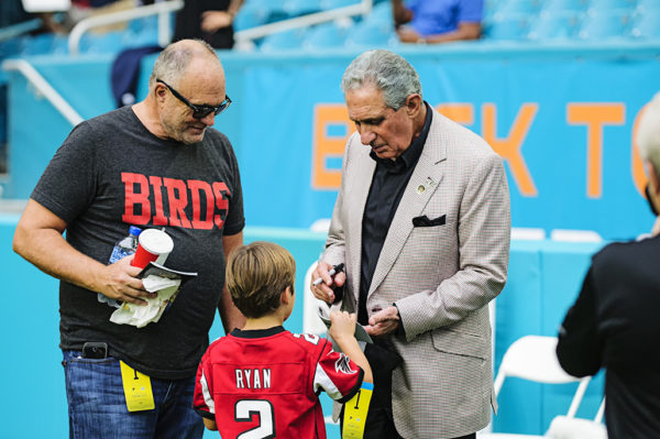 Atlanta Falcons owner, Arthur Blank, signs autographs for fans