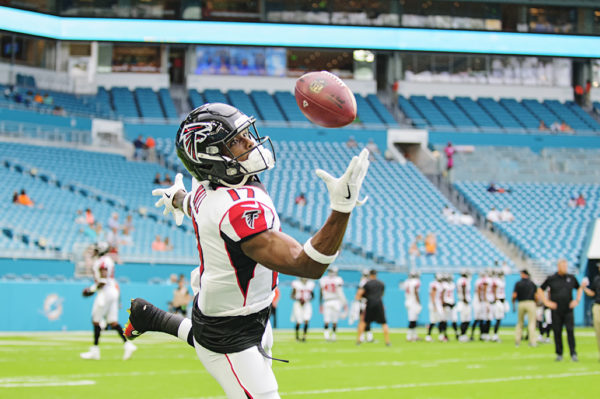 Falcons WR, #17 Marvin Hall, tries to haul in a pass during warm ups