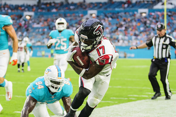 Falcons WR, #17 Marvin Hall, gets pushed out of bounds after making a catch