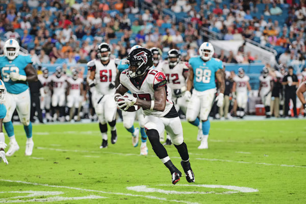 #17, Marvin Hall, runs after a catch