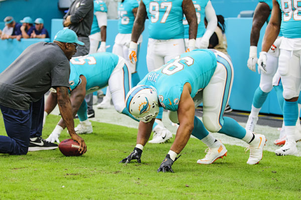 Dolphins DL, #93 Ndamukong Suh, practices his technique prior to the game