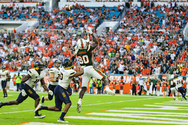 Hurricanes WR, Dayall Harris, leaps to haul in his first touchdown pass of the season