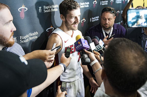 Heat point guard, Goran Dragic, is surrounded by media