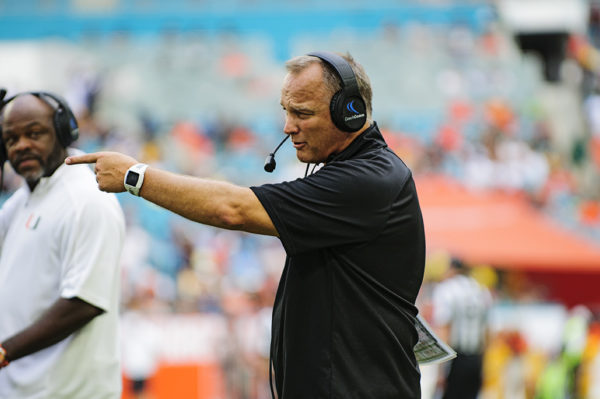 Mark Richt points something out to the referee