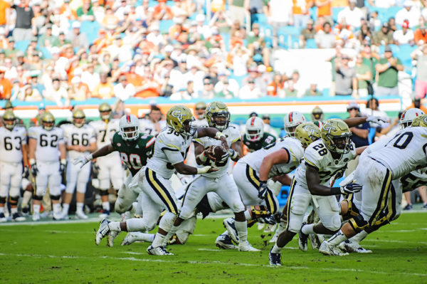 TaQuon Marshall (16) fakes a hand-off to KirVonte Benson (30)