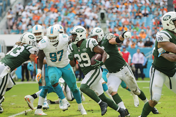 Bilal Powell (29) runs the ball