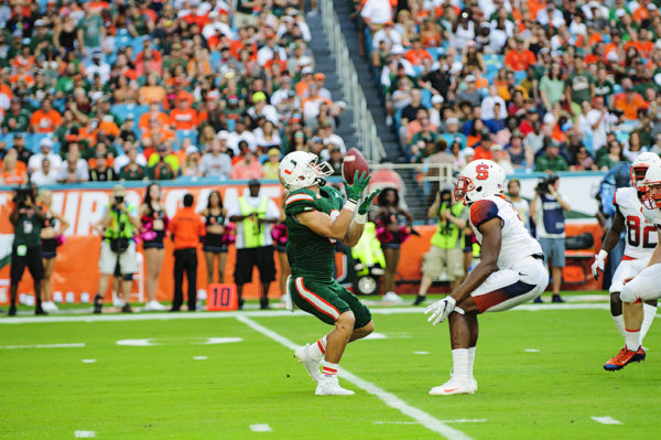 Braxton Berrios catches a punt with pressure in his face