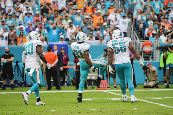 Cam Wake (91) celebrates a sack