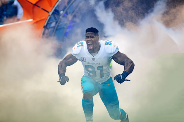 Cameron Wake screams as he comes out through the tunnel
