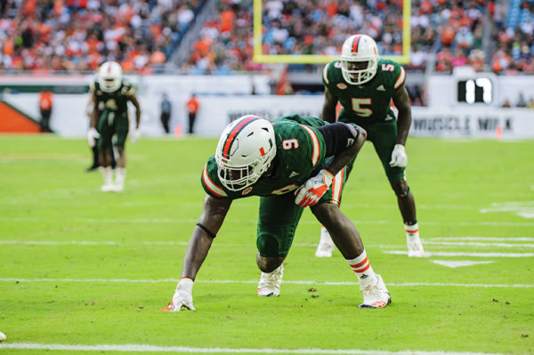 Hurricanes defensive end Chad Thomas (9)