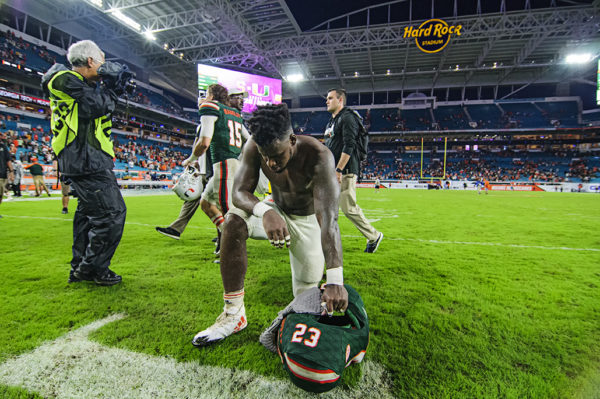 Christopher Herndon kneels after the game