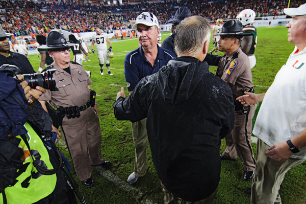 Coaches meet after the game