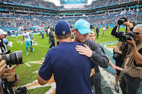Both head coaches meet at midfield after the game