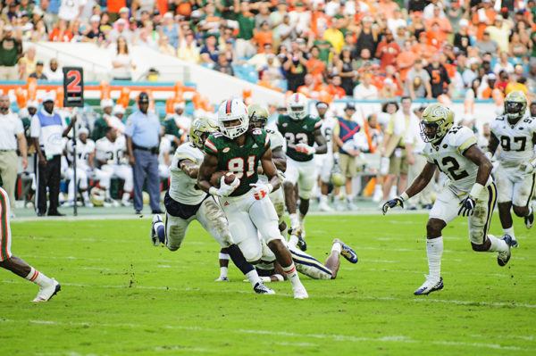 Darrell Langham (81) runs up field after completing a catch