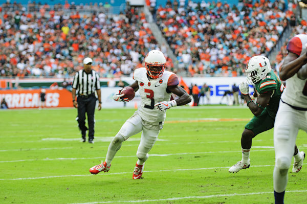Ervin Phillips (3) tries to find an opening to run through