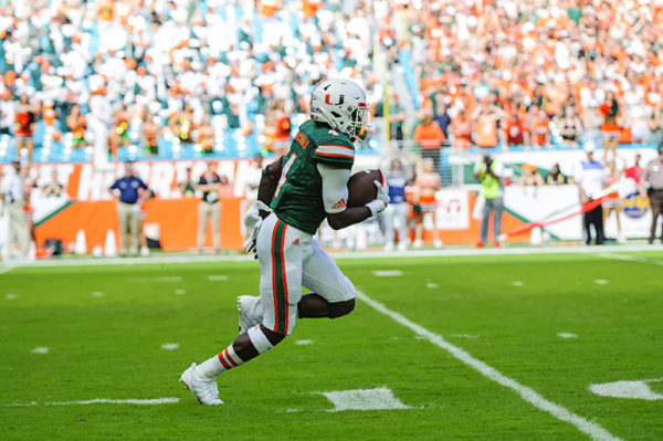 Jeff Thomas runs a kick-off back