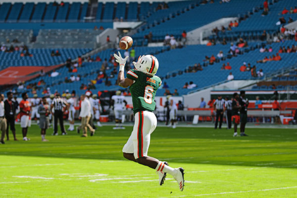 Jhavonte Dean catches passes  during drills