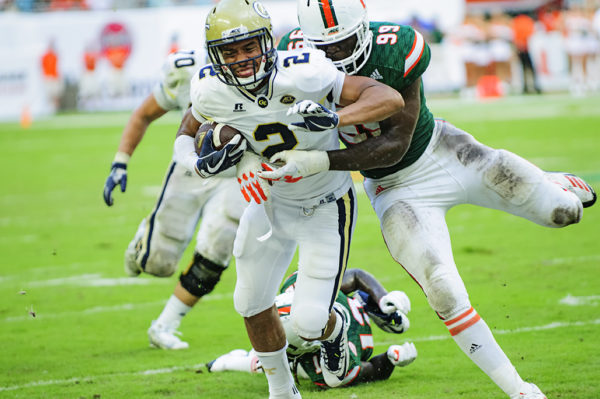 Joe Jackson (99) tackles Ricky Jeune (2) from behind