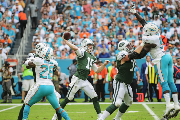 Josh McCown (15) throws a pass