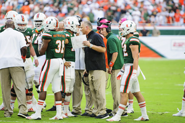 Mark Richt gives some last minute advice to Malik Rosier during a timeout