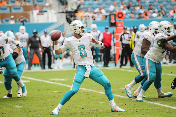 Matt Moore (8) looks to throw the ball