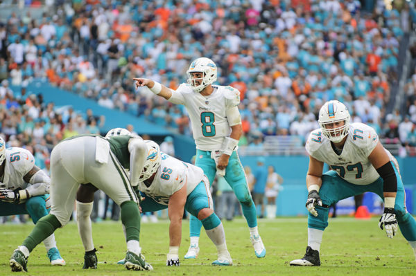 Matt Moore (8) calls out the defense assignments